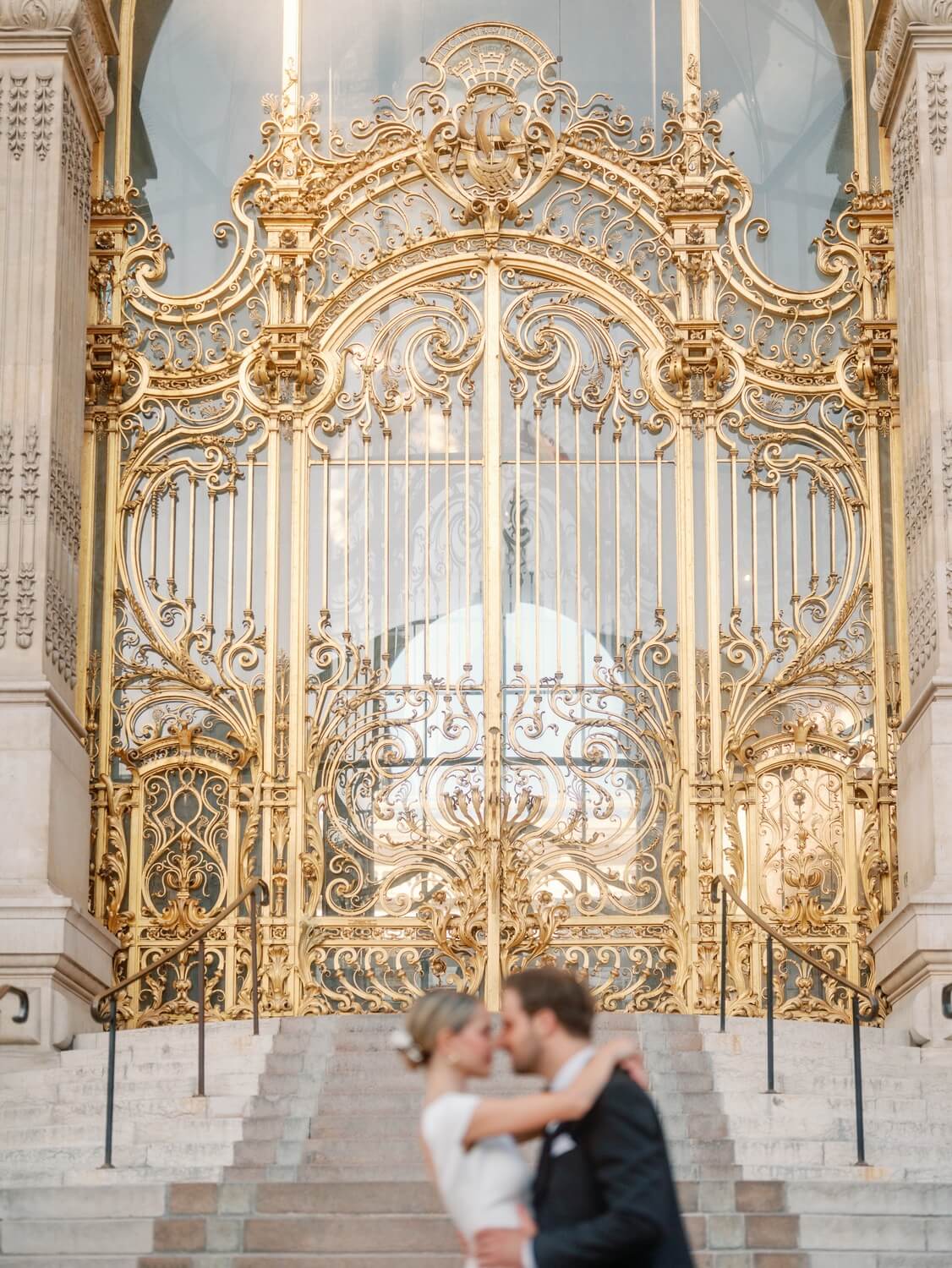 Ornate golden doors at a Paris wedding venue — Guillaume Gimenez Photography